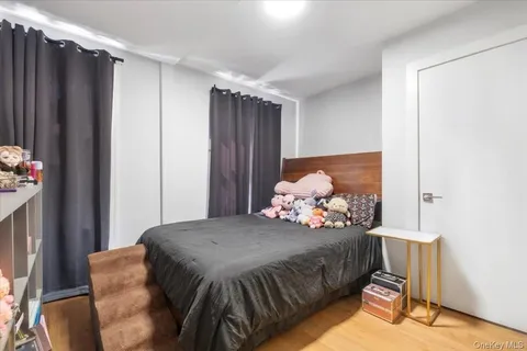 a bedroom with bed and window