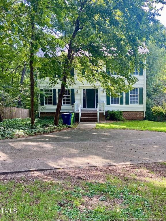 4219 Arbutus Drive, Unit A Raleigh, NC 27612 - Photo 2 of 30 a front view of house with yard and green space