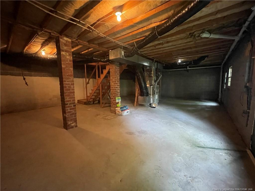 4219 Arbutus Drive, Unit A Raleigh, NC 27612 - Photo 26 of 30 a view of a room with wooden floor