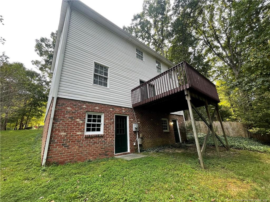 4219 Arbutus Drive, Unit A Raleigh, NC 27612 - Photo 27 of 30 a view of a house with a yard