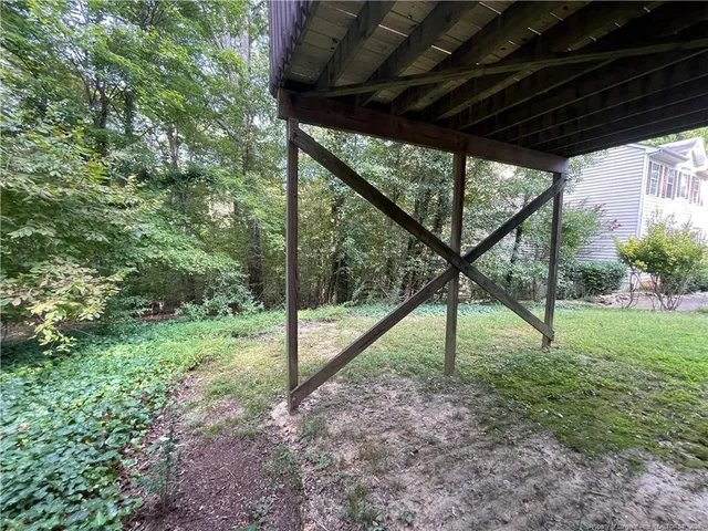 a kitchen with kitchen island granite countertop a sink window and cabinets
