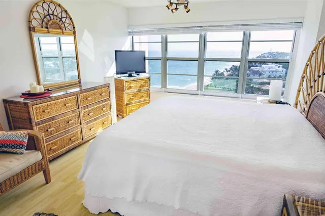 a bed room with a bed and a window