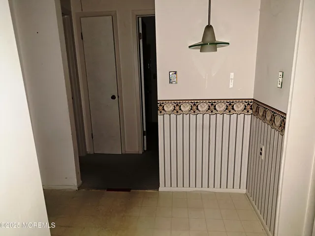 a view of a hallway with a door