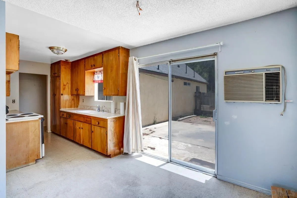 14035 Proctor Valley Road Jamul, CA 91935 - Photo 17 of 53 a en suite bathroom with a granite countertop sink and mirror