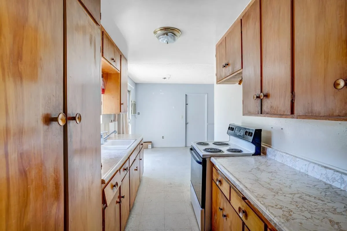 14035 Proctor Valley Road Jamul, CA 91935 - Photo 19 of 53 a bathroom with a granite countertop sink