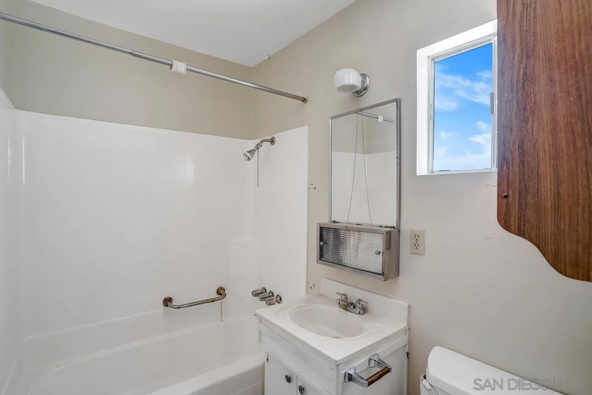 14035 Proctor Valley Road Jamul, CA 91935 - Photo 23 of 53 a bathroom with a sink toilet and shower