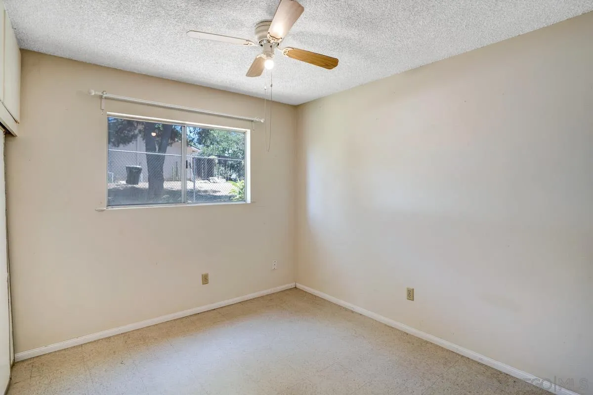 14035 Proctor Valley Road Jamul, CA 91935 - Photo 24 of 53 an empty room with a window and a fan
