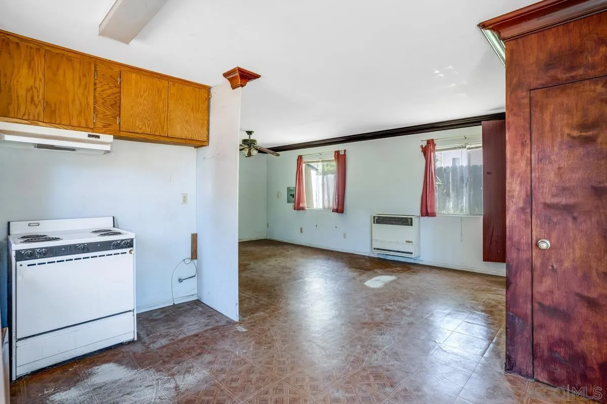 14035 Proctor Valley Road Jamul, CA 91935 - Photo 29 of 53 a view of a kitchen with refrigerator and wooden floor