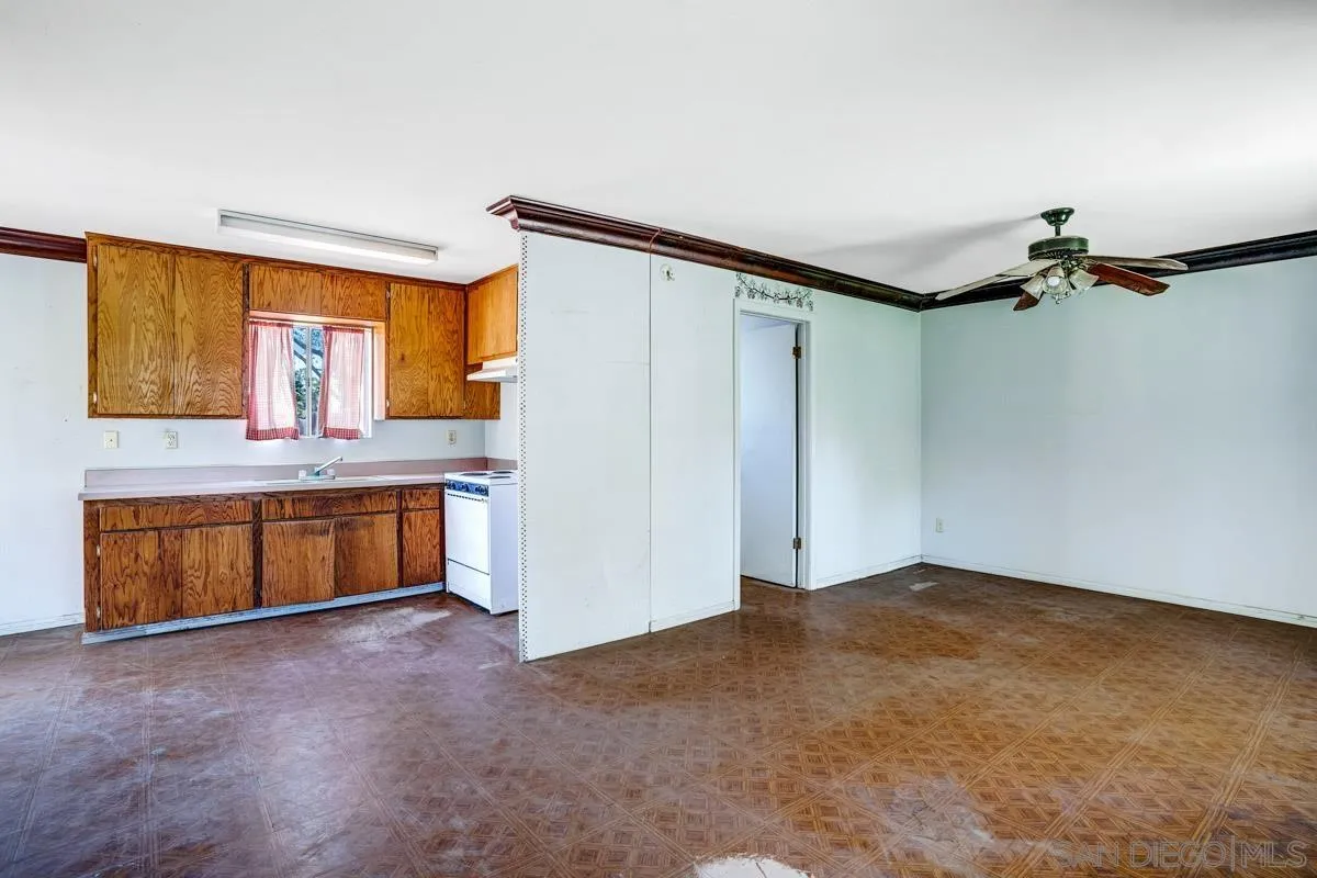 14035 Proctor Valley Road Jamul, CA 91935 - Photo 31 of 53 a bathroom with a tub sink and mirror