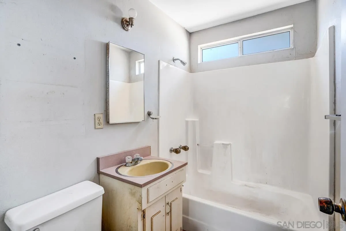 14035 Proctor Valley Road Jamul, CA 91935 - Photo 32 of 53 a bathroom with a sink toilet and shower