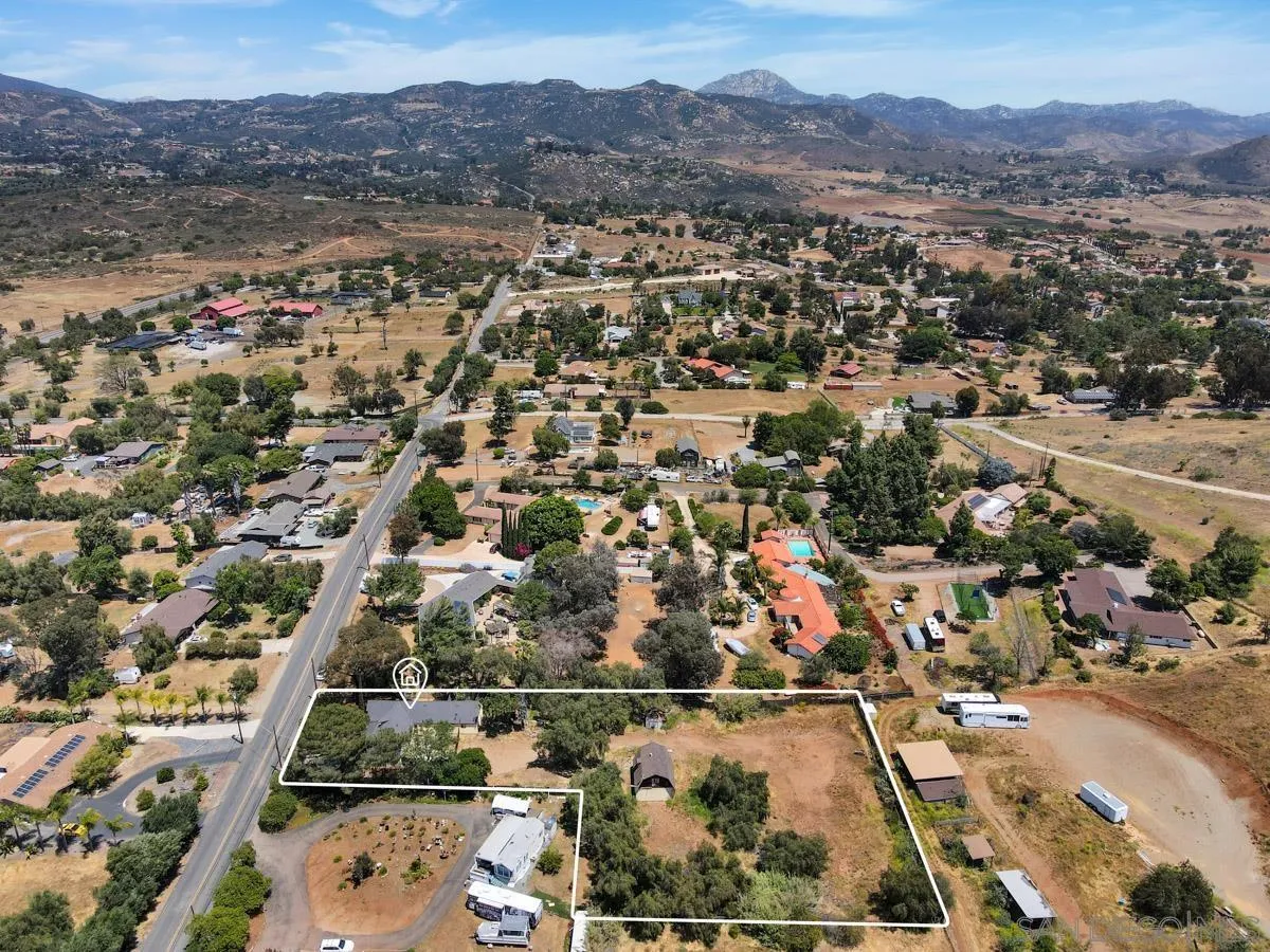 14035 Proctor Valley Road Jamul, CA 91935 - Photo 4 of 53 an aerial view of residential houses and outdoor space