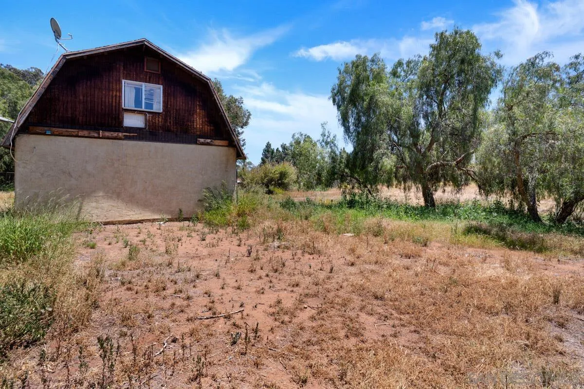 14035 Proctor Valley Road Jamul, CA 91935 - Photo 42 of 53 a view of a house with a yard