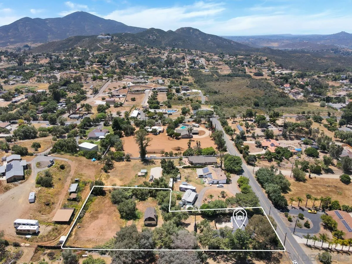 14035 Proctor Valley Road Jamul, CA 91935 - Photo 5 of 53 an aerial view of residential houses with outdoor space