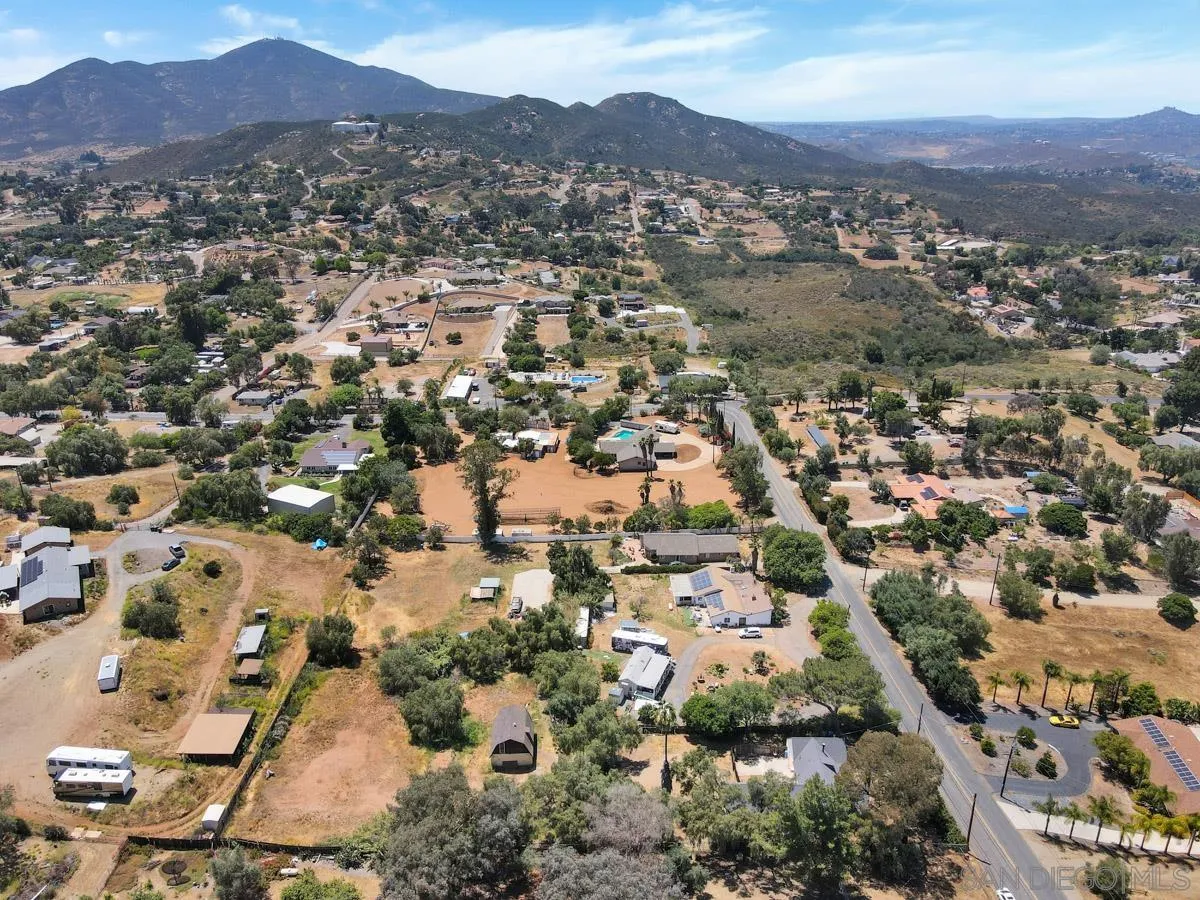 14035 Proctor Valley Road Jamul, CA 91935 - Photo 53 of 53 an aerial view of residential houses with outdoor space and trees