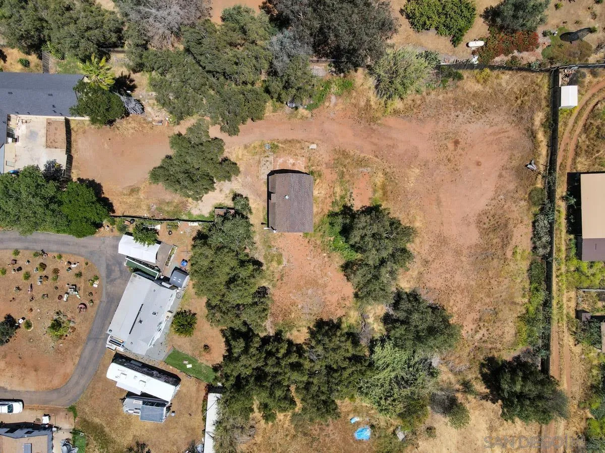 14035 Proctor Valley Road Jamul, CA 91935 - Photo 8 of 53 an aerial view of residential houses with outdoor space