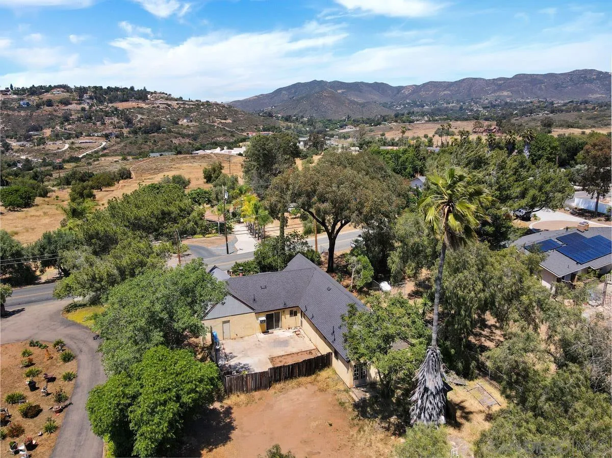 14035 Proctor Valley Road Jamul, CA 91935 - Photo 9 of 53 an aerial view of residential house and sandy dunes