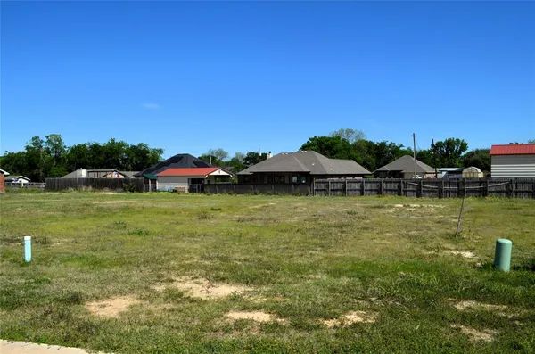 a view of a lake with a yard