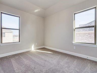 4717 Ladrillo Lane McKinney, TX 75070 - Photo 12 of 24 Empty room with baseboards and light colored carpet