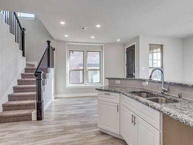 4717 Ladrillo Lane McKinney, TX 75070 - Photo 17 of 24 Kitchen featuring light stone countertops, plenty of natural light, light wood-style flooring, recessed lighting, and white cabinets