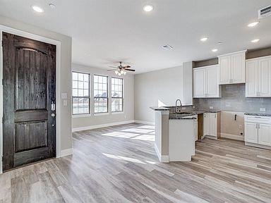 4717 Ladrillo Lane McKinney, TX 75070 - Photo 18 of 24 Kitchen featuring a peninsula, recessed lighting, backsplash, light wood-type flooring, and ceiling fan