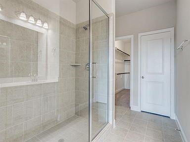 4717 Ladrillo Lane McKinney, TX 75070 - Photo 22 of 24 Full bathroom featuring light tile patterned floors, a shower stall, and a spacious closet