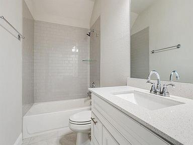 4717 Ladrillo Lane McKinney, TX 75070 - Photo 24 of 24 Full bath featuring vanity, shower combination, and light tile patterned floors