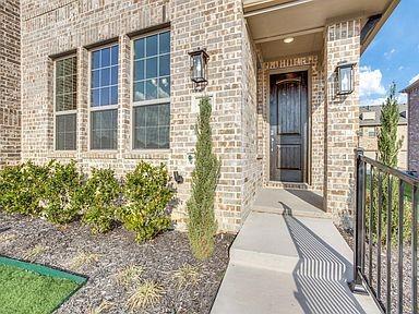 4717 Ladrillo Lane McKinney, TX 75070 - Photo 3 of 24 View of exterior entry featuring brick siding