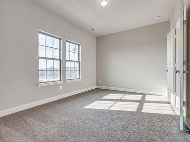 4717 Ladrillo Lane McKinney, TX 75070 - Photo 10 of 24 Unfurnished room with light colored carpet and baseboards