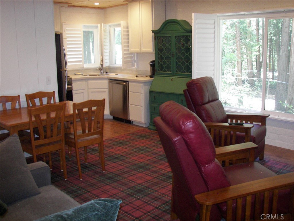 1101 Big Tree Lane Crestline, CA 92325 - Photo 16 of 30 a view of a dining room with furniture window and outside view