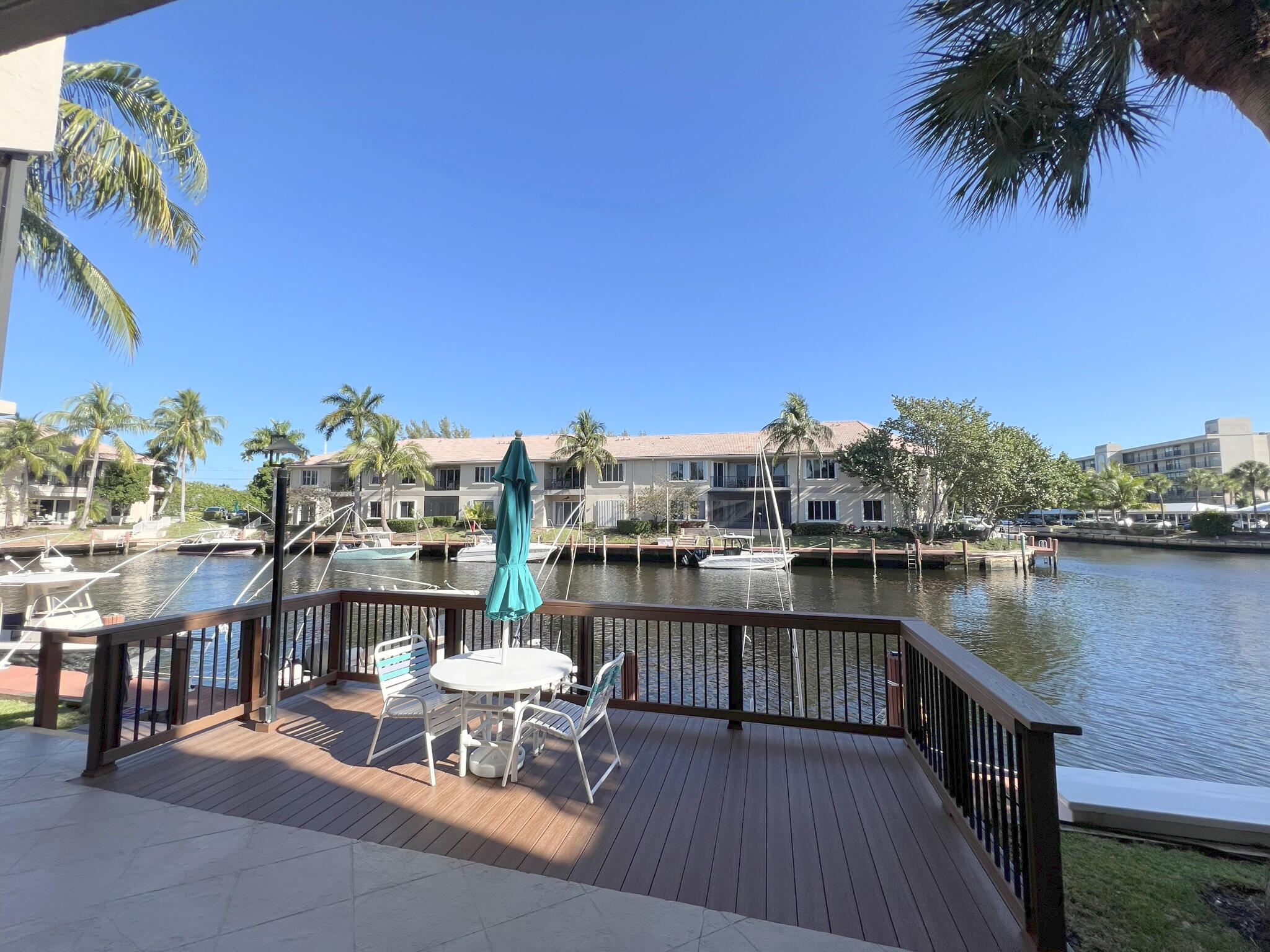 1 Royal Palm Way, Unit 3050 Boca Raton, FL 33432 - Photo 1 of 24 a view of a lake with a table and chairs