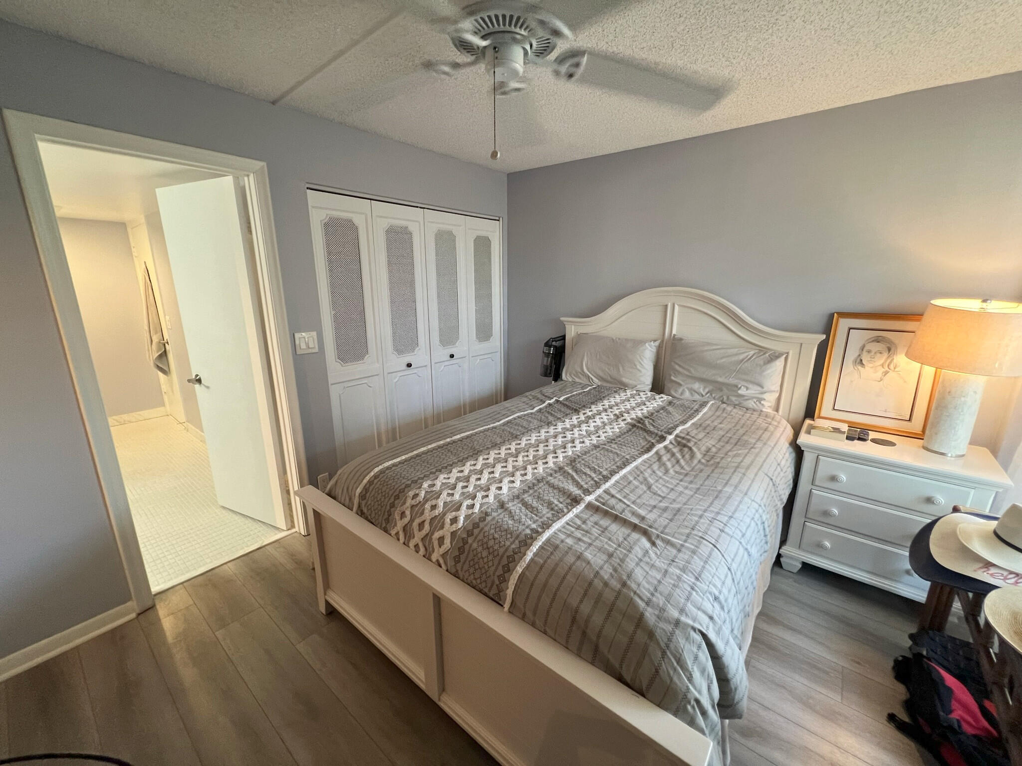 1 Royal Palm Way, Unit 3050 Boca Raton, FL 33432 - Photo 14 of 24 a bedroom with a bed and a dresser