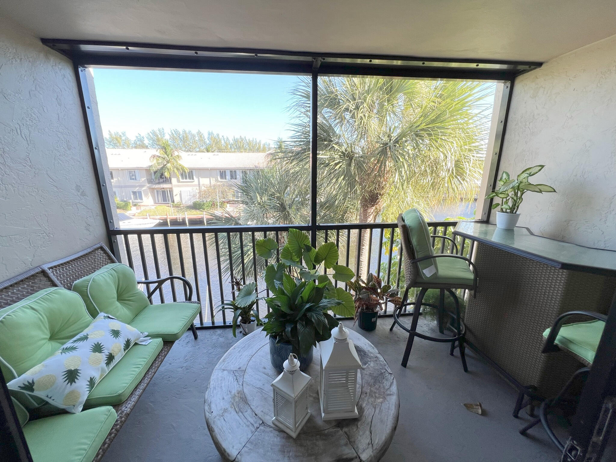 1 Royal Palm Way, Unit 3050 Boca Raton, FL 33432 - Photo 3 of 24 a view of a porch with furniture and a potted plant