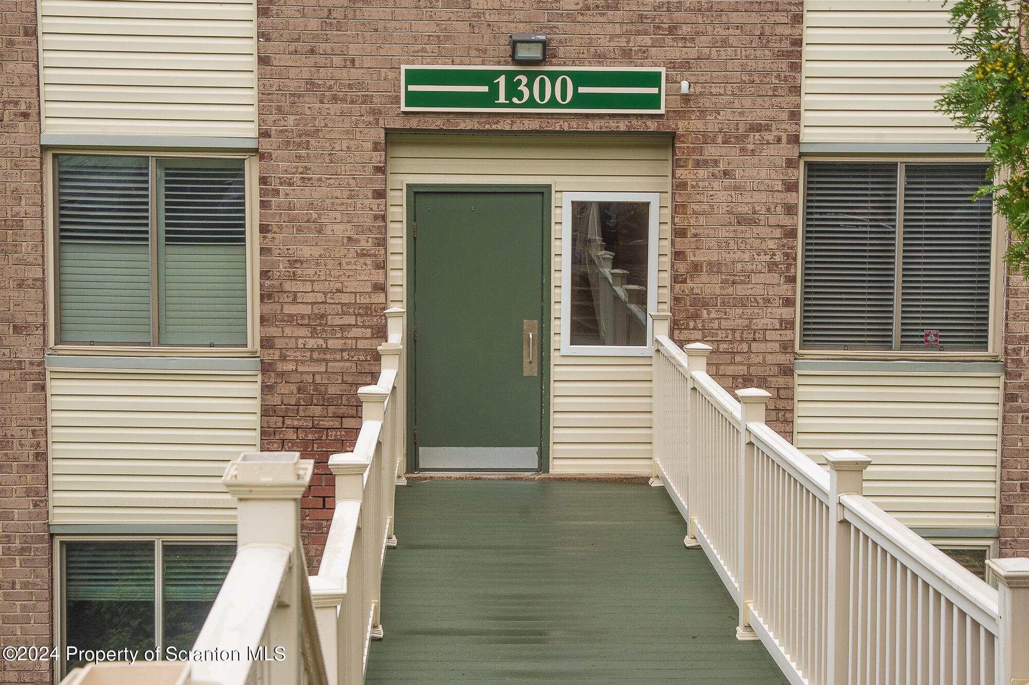 1311 Summit Pointe Scranton, PA 18508 - Photo 1 of 29 a view of a brick house with stairs