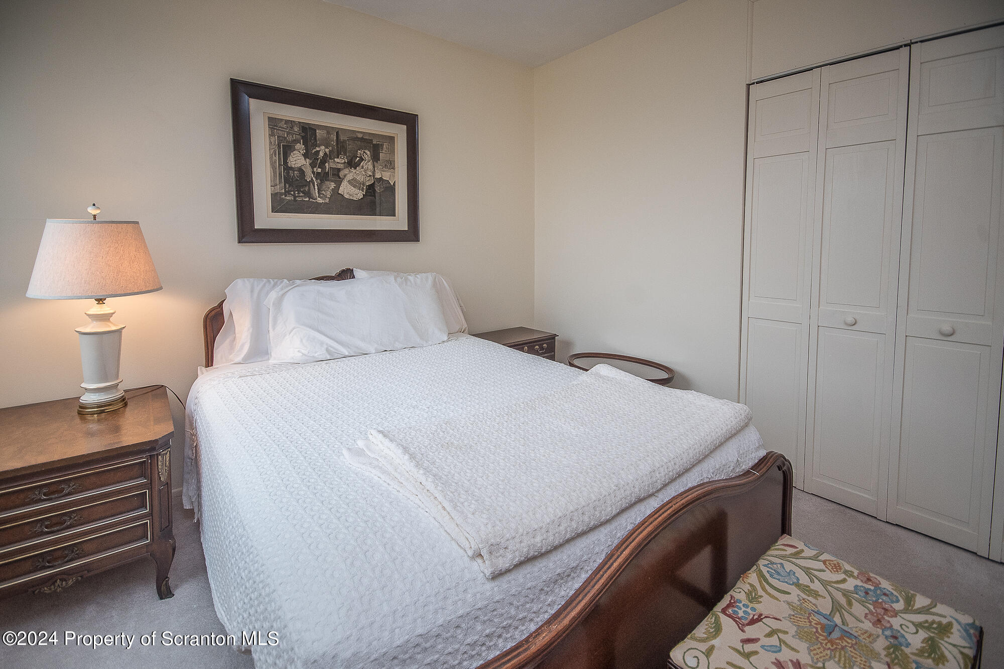 1311 Summit Pointe Scranton, PA 18508 - Photo 15 of 29 a bedroom with a bed and a lamp on dresser