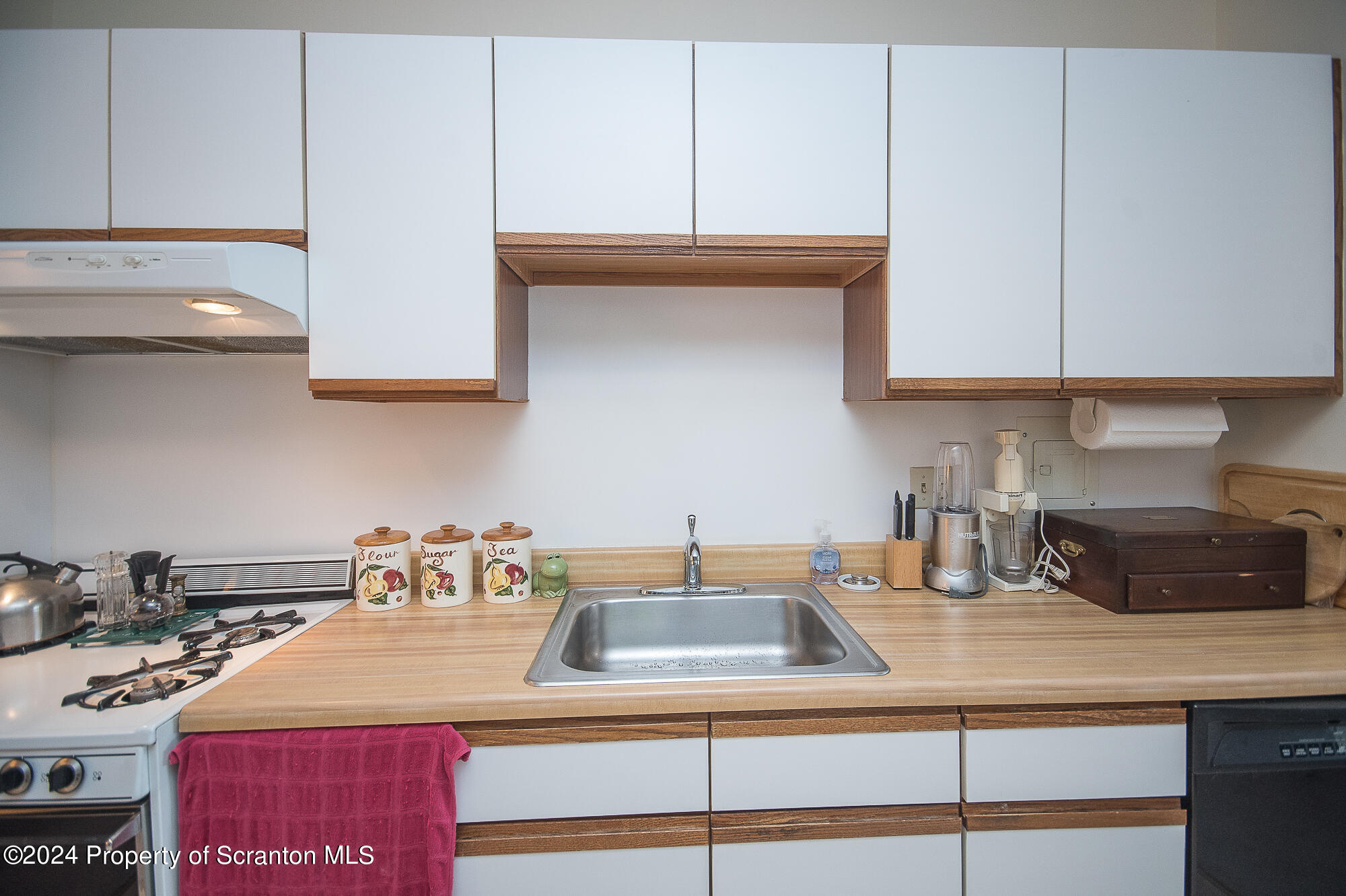 1311 Summit Pointe Scranton, PA 18508 - Photo 7 of 29 a kitchen with a sink a stove and cabinets