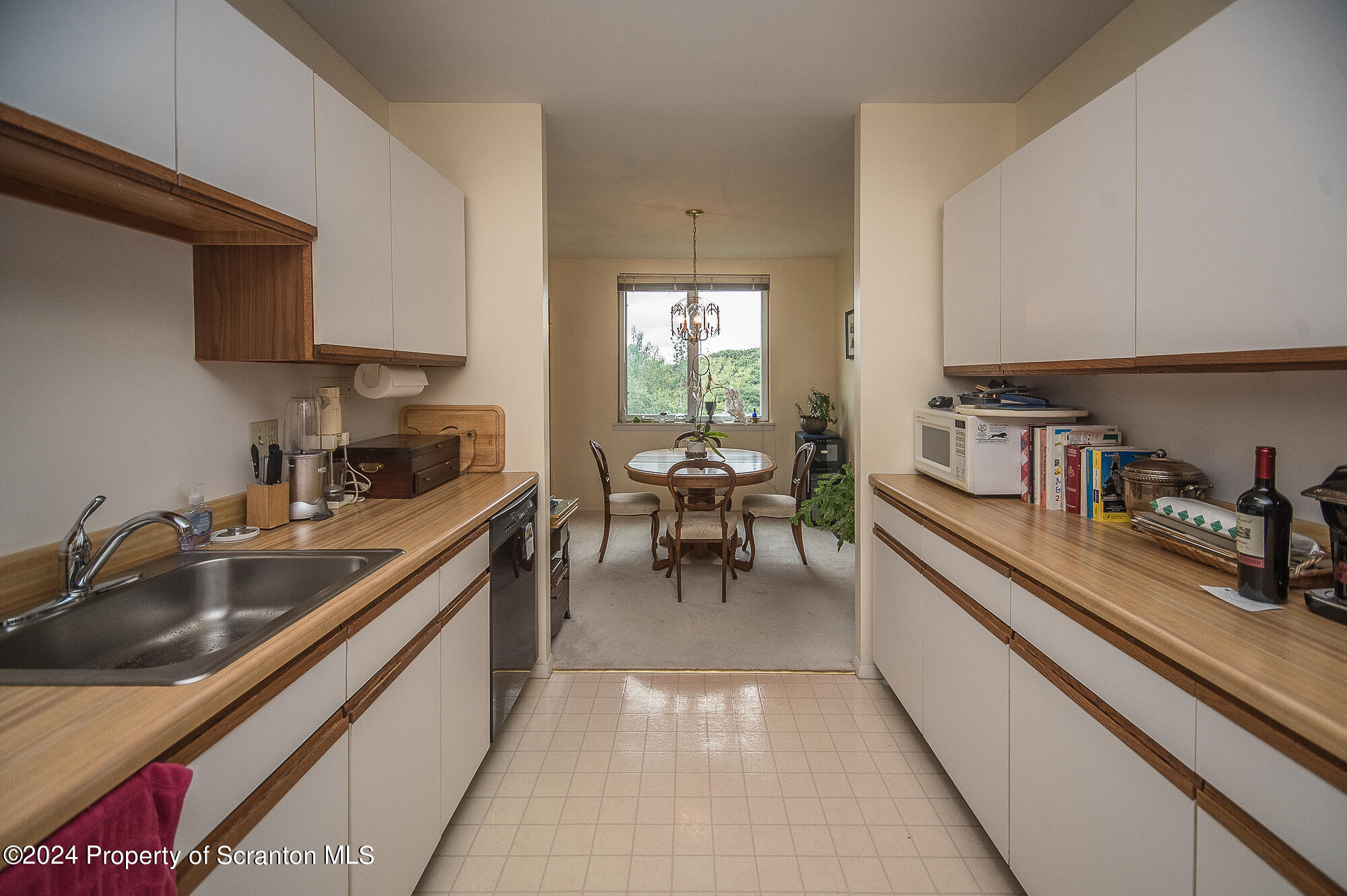 1311 Summit Pointe Scranton, PA 18508 - Photo 8 of 29 a kitchen with a sink and chairs