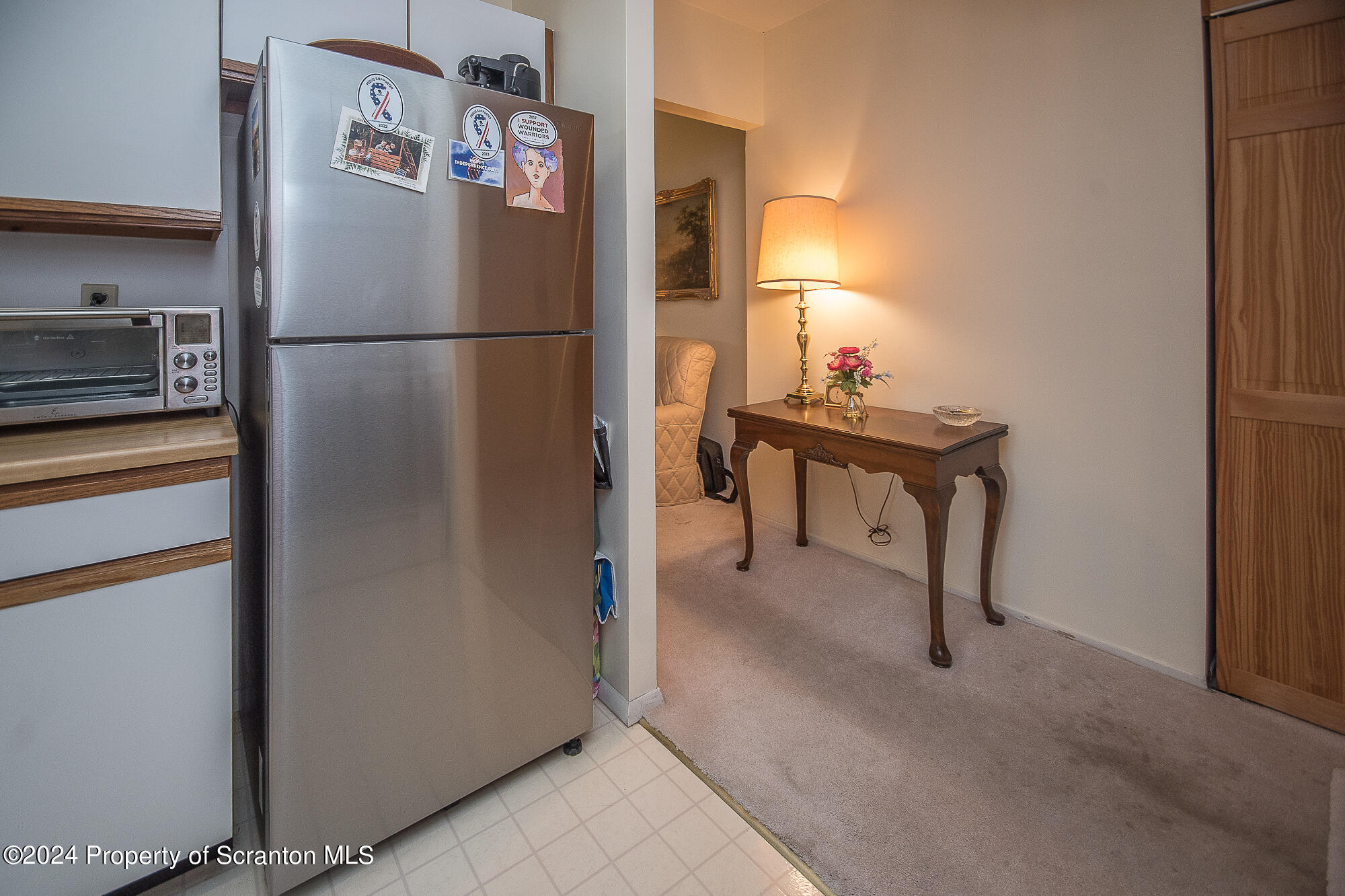 1311 Summit Pointe Scranton, PA 18508 - Photo 9 of 29 a kitchen with a refrigerator and cabinets