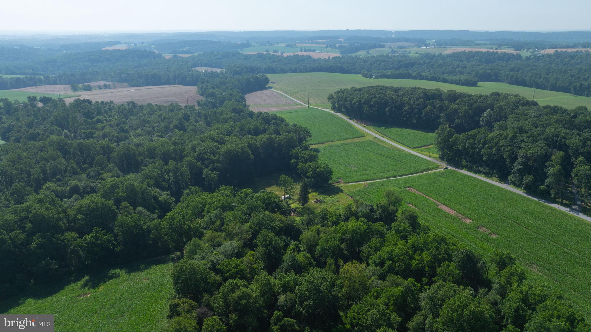 267 Cook Road Delta, PA 17314 - Photo 11 of 28 an aerial view of green landscape with trees all around