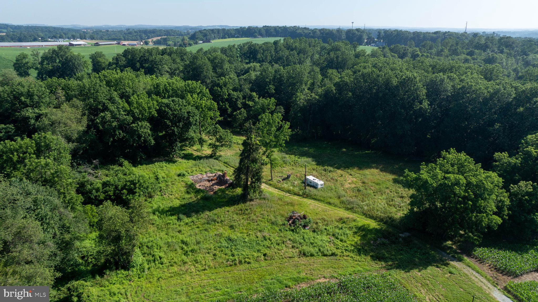 267 Cook Road Delta, PA 17314 - Photo 23 of 28 a view of a garden with a building in background