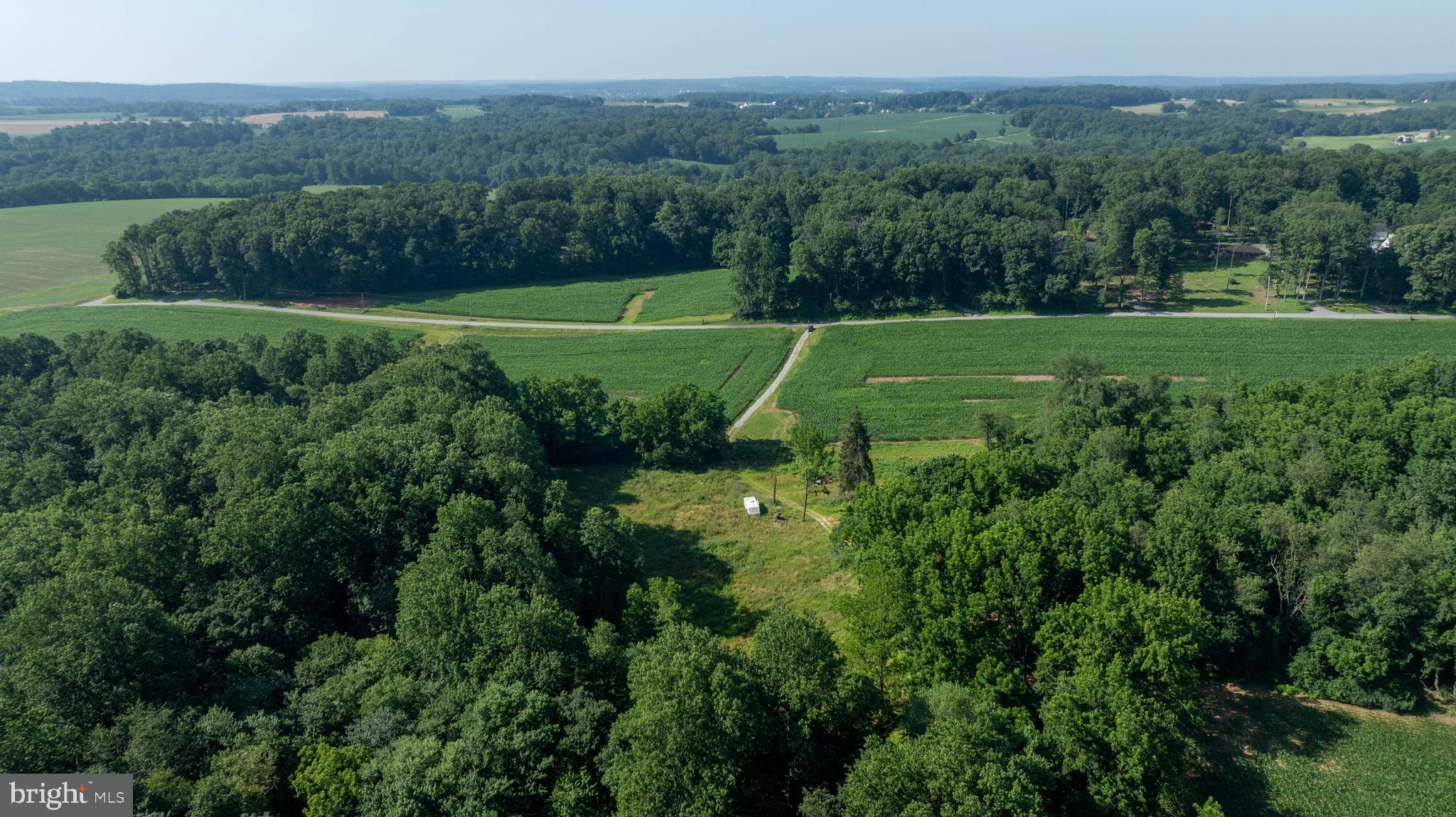 267 Cook Road Delta, PA 17314 - Photo 7 of 28 a view of a field with a tree in the background