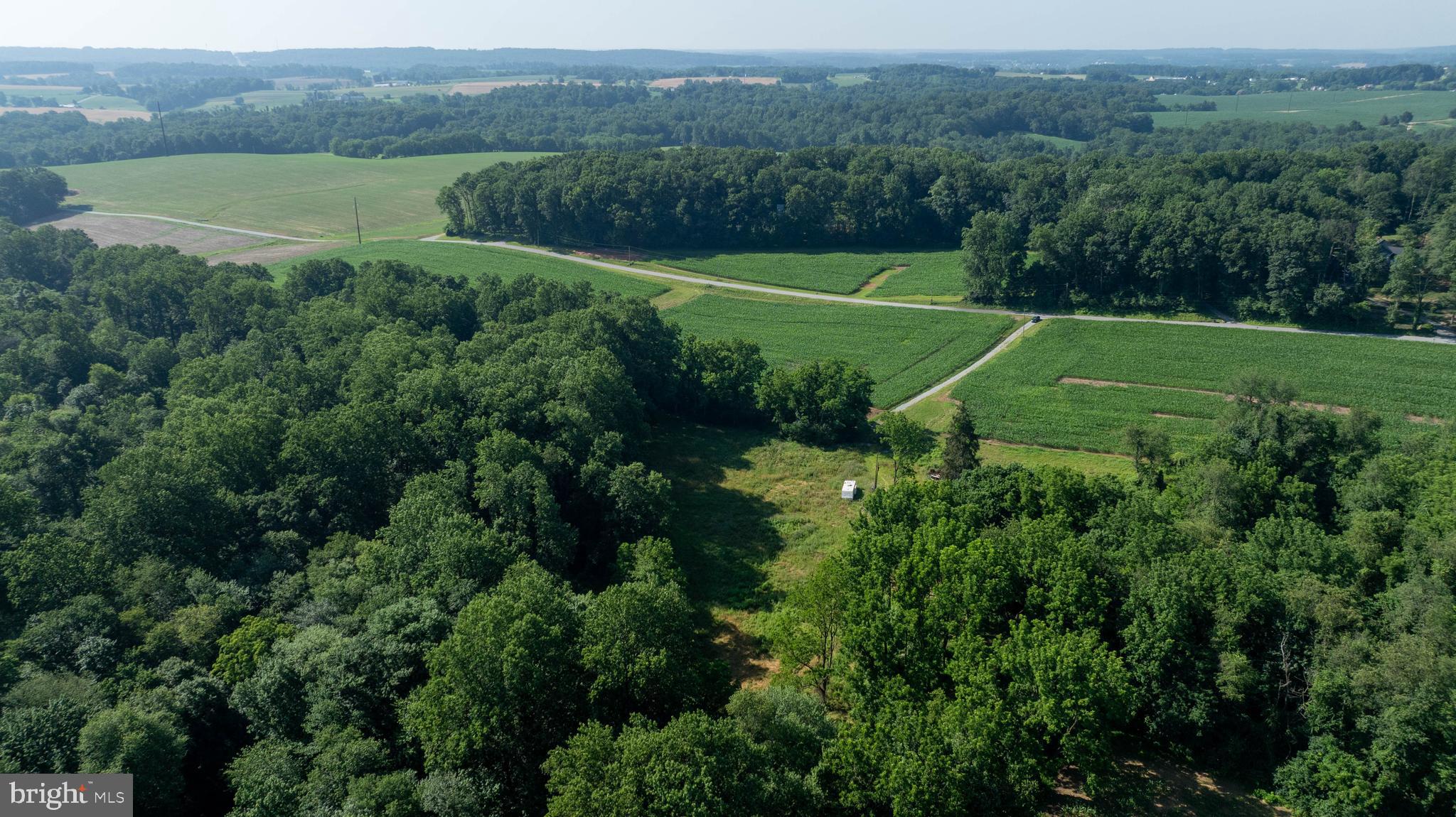 267 Cook Road Delta, PA 17314 - Photo 8 of 28 a view of a lake with a big yard