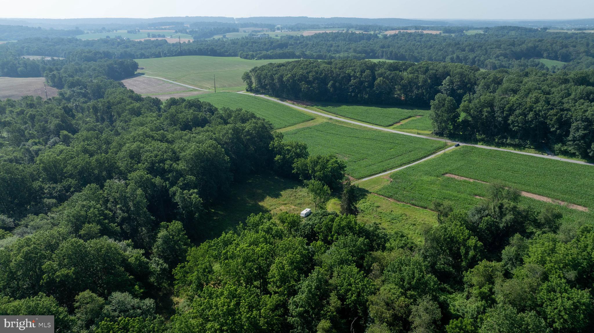 267 Cook Road Delta, PA 17314 - Photo 9 of 28 an aerial view of green landscape with trees