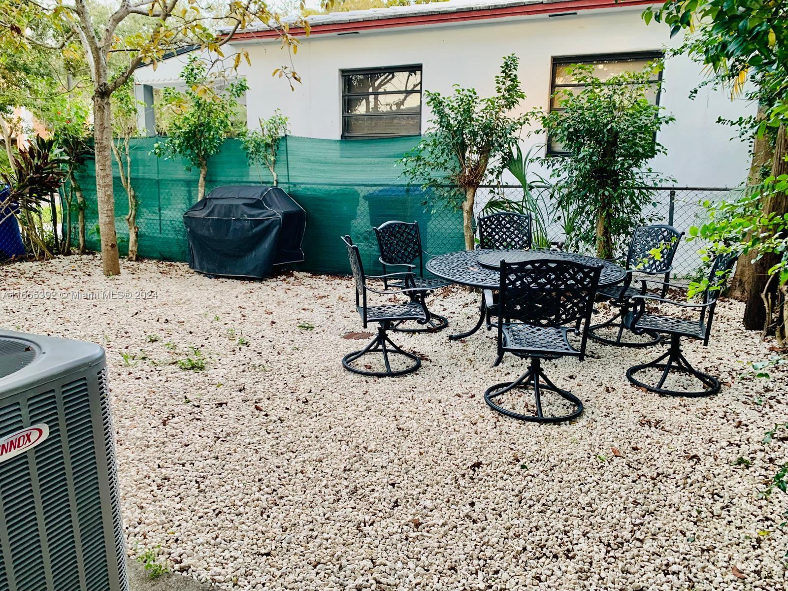 2 Northeast 45th Street, Unit 4 Miami, FL 33137 - Photo 11 of 15 a view of a backyard with furniture and plants