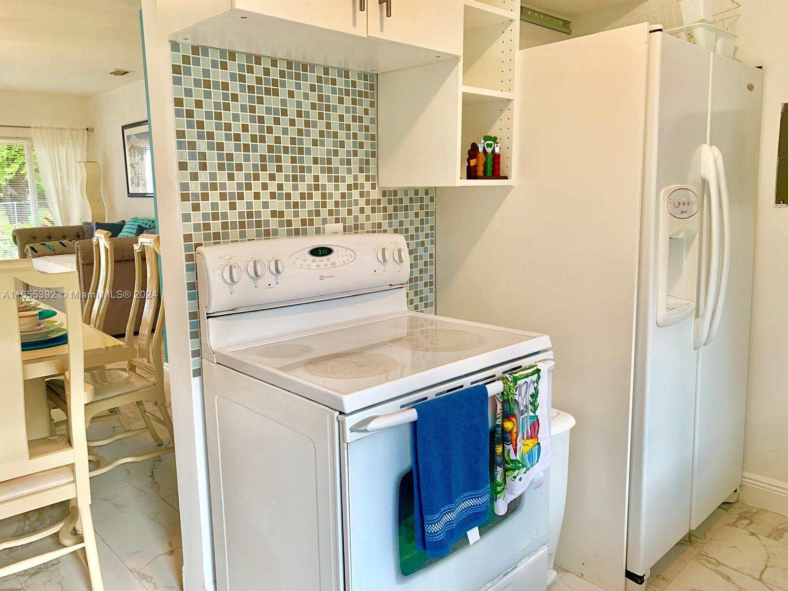 2 Northeast 45th Street, Unit 4 Miami, FL 33137 - Photo 7 of 15 a utility room with dryer and washer