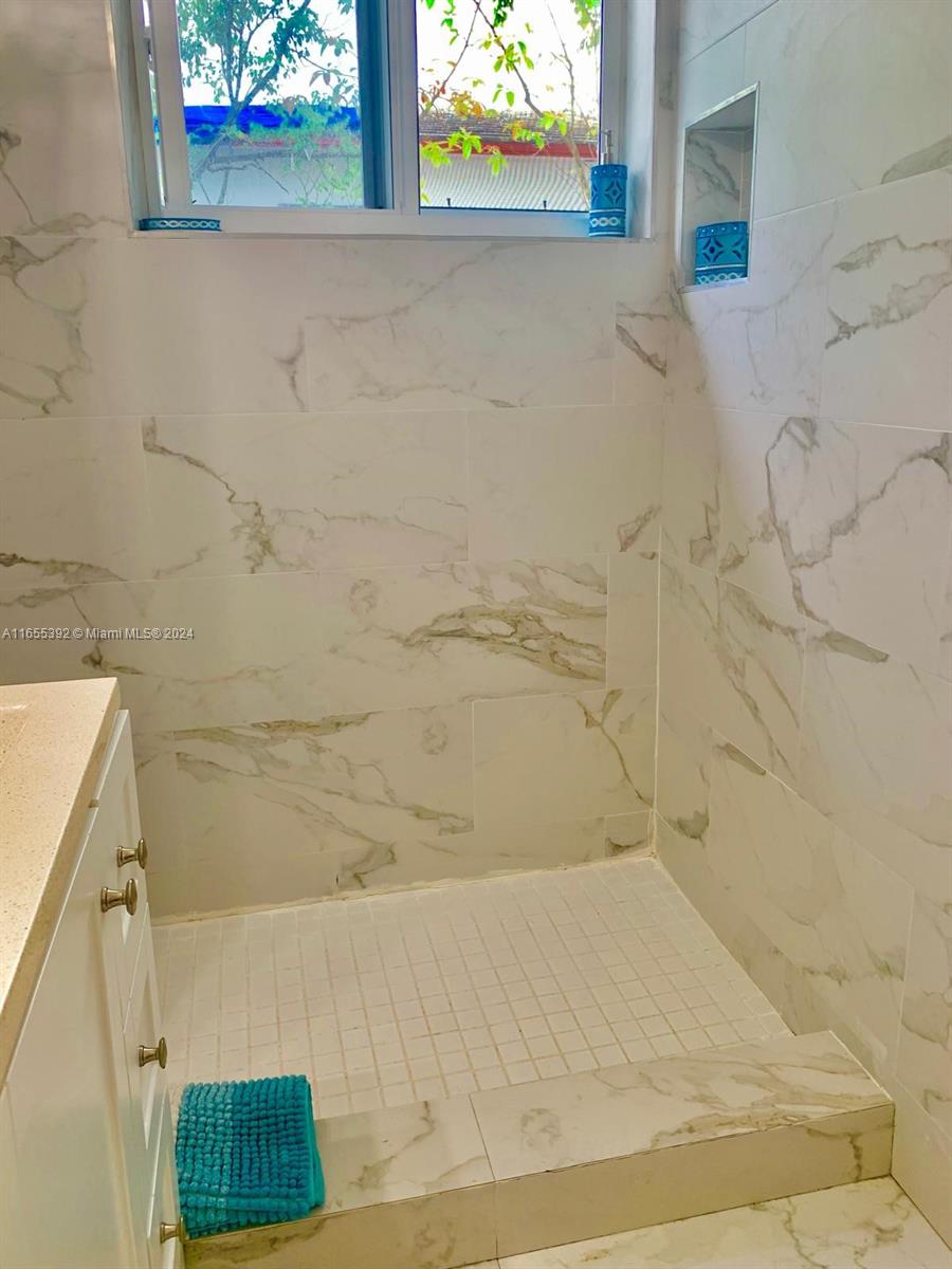 2 Northeast 45th Street, Unit 4 Miami, FL 33137 - Photo 9 of 15 a bathroom with a shower