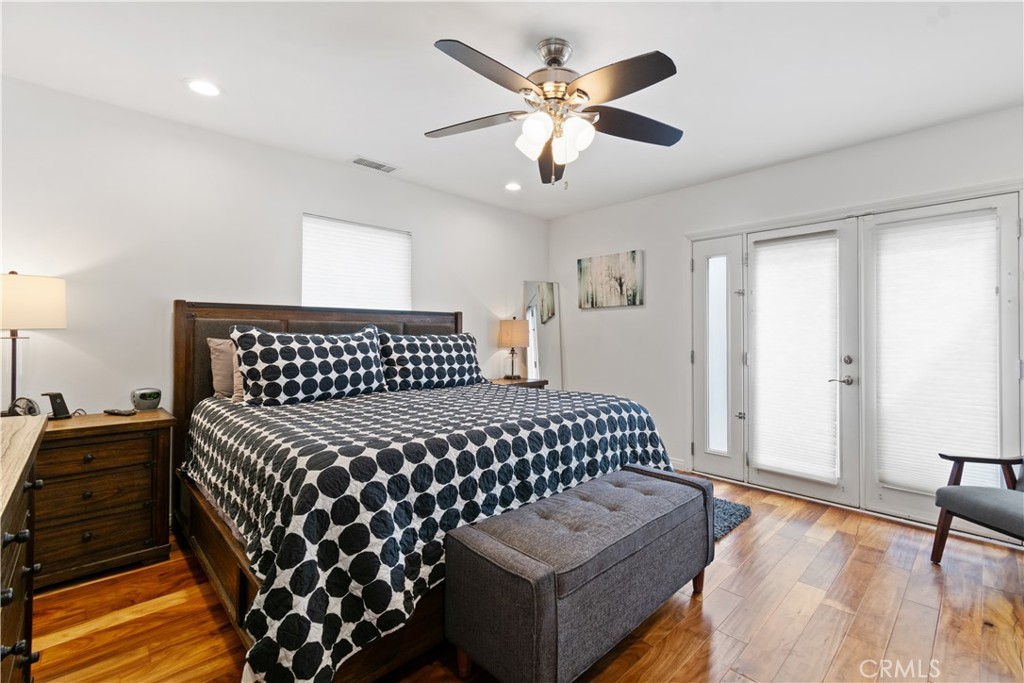 275 Mountain View Street Altadena, CA 91001 - Photo 15 of 30 a bedroom with a bed and wooden floor