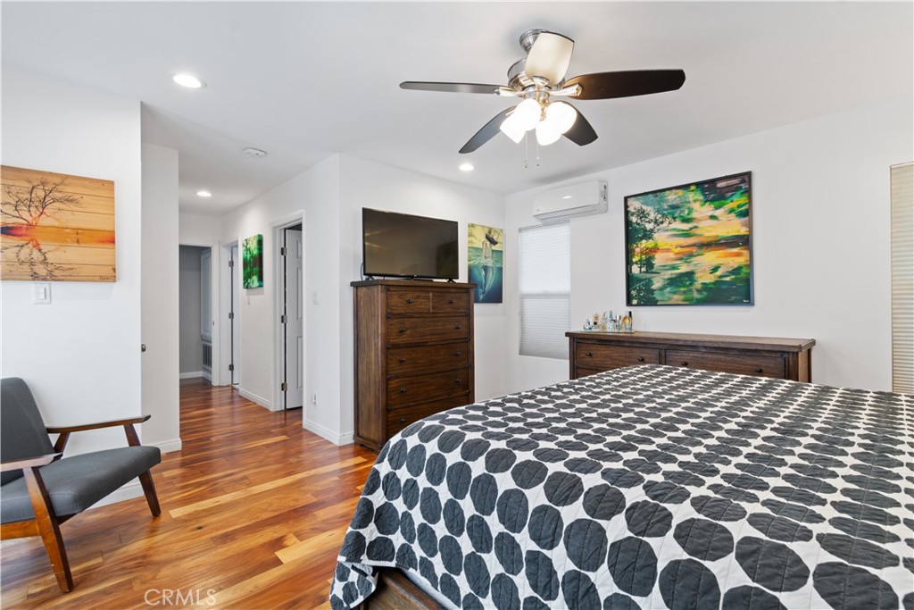 275 Mountain View Street Altadena, CA 91001 - Photo 17 of 30 a bedroom with a bed and a flat screen tv