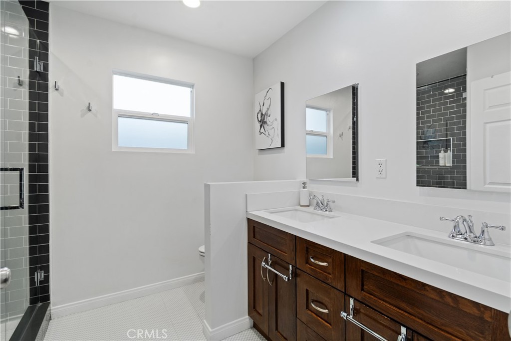 275 Mountain View Street Altadena, CA 91001 - Photo 19 of 30 a bathroom with a sink a vanity and a mirror