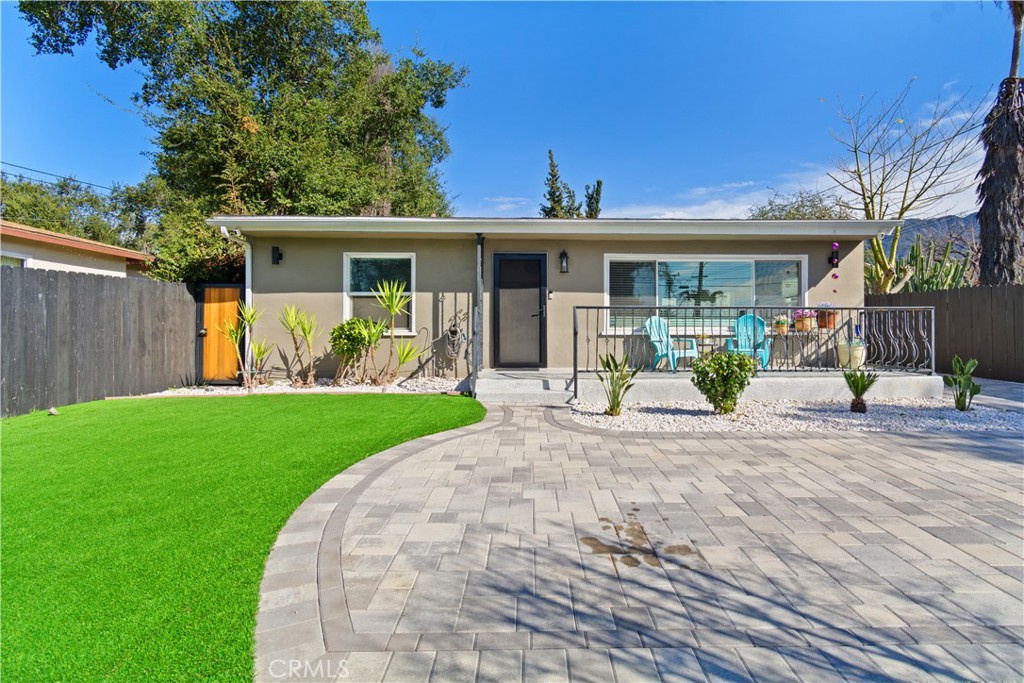 275 Mountain View Street Altadena, CA 91001 - Photo 2 of 30 a front view of a house with a yard and potted plants
