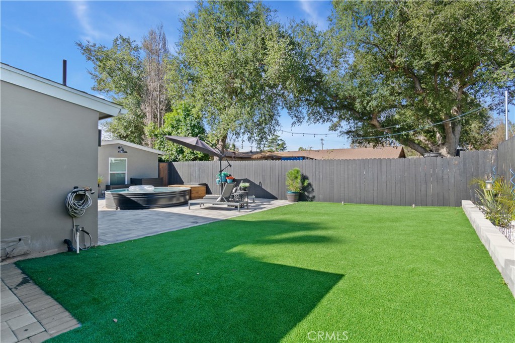 275 Mountain View Street Altadena, CA 91001 - Photo 26 of 30 a view of a backyard with table and chairs and a fire pit